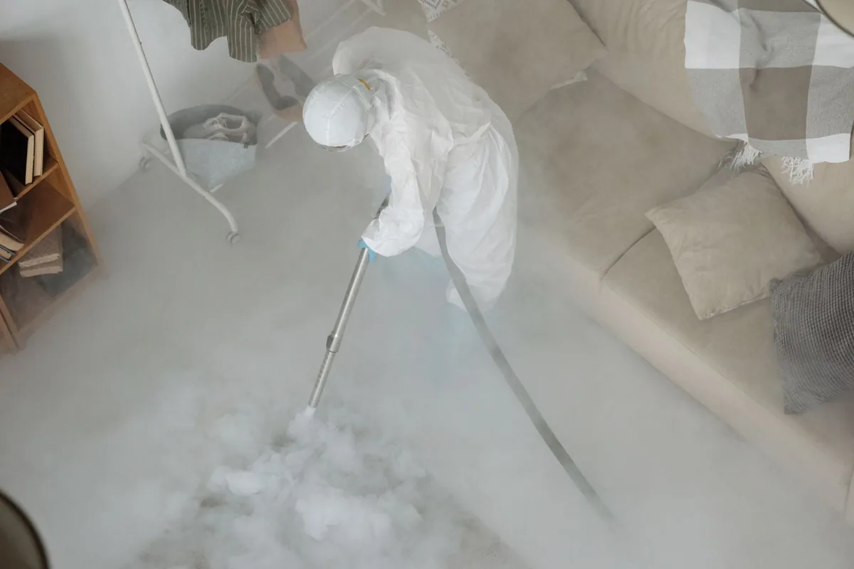 Biohazard cleanup technician in protective equipment, Centreville, MS